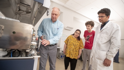 Students and professor in a lab 